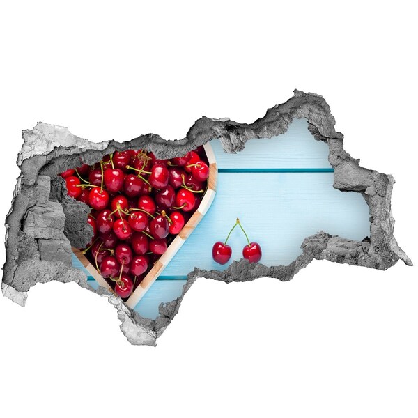 Hole wall sticker Sweet cherries on a blue background