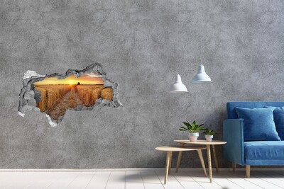 Hole wall sticker Golden sunset over a grain field