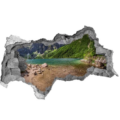 Hole wall sticker Mountain lake in the valley