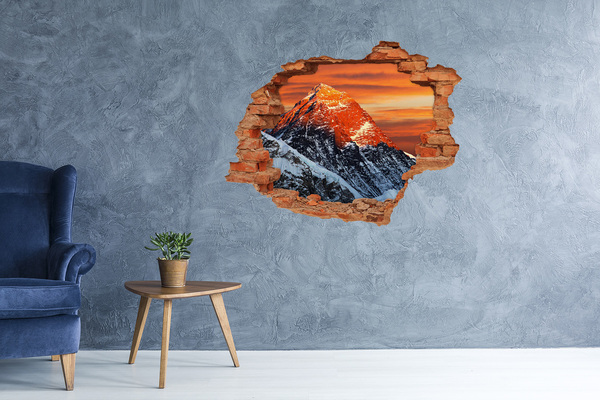 Hole wall sticker Mountains in the setting sun
