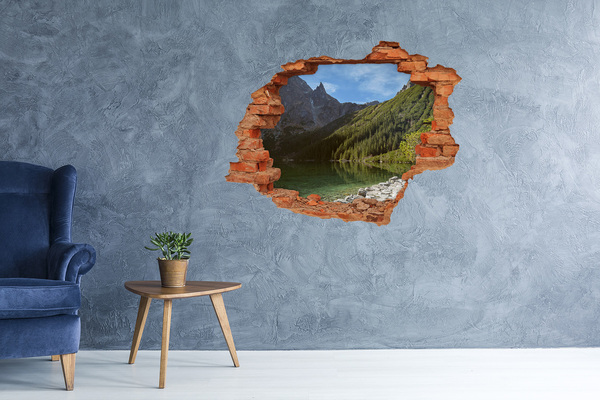 Hole wall sticker Mountain lake in the valley