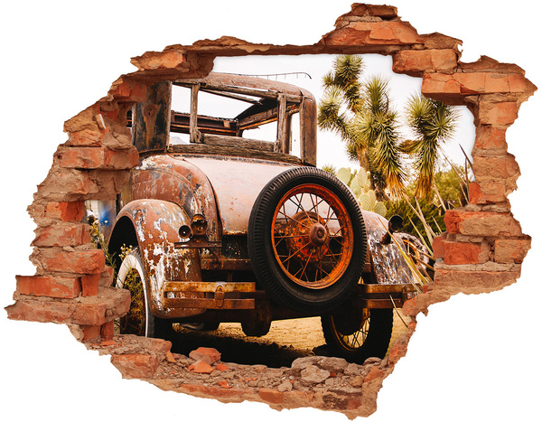 Hole wall sticker Rusty car in a desert landscape