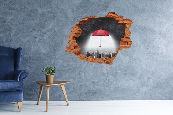 Hole in the wall sticker Red umbrella in the urban landscape