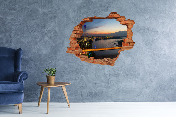 Hole in the wall sticker View of the city at sunset