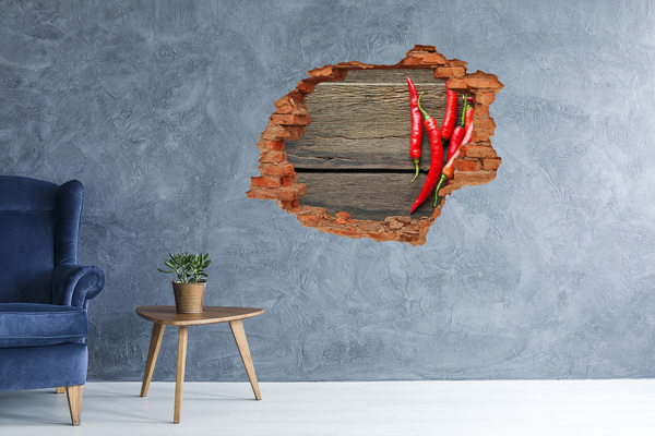 Hole in the wall sticker Chili peppers on a wooden surface