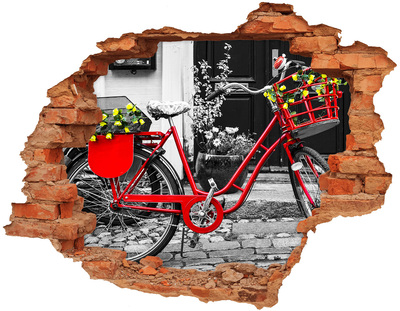 Hole in the wall decal A red bicycle in an urban setting