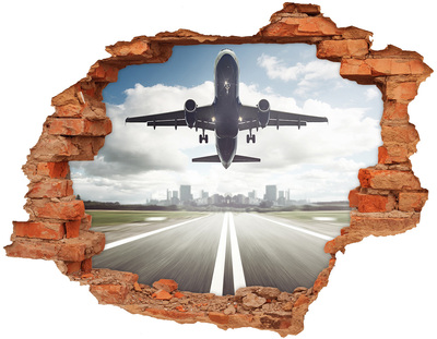 Hole in the wall sticker Plane landing in the city