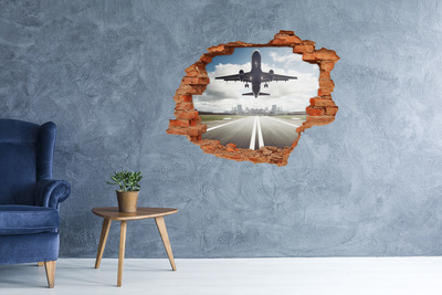 Hole in the wall sticker Plane landing in the city