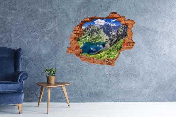 Hole wall sticker Mountain valley with a lake