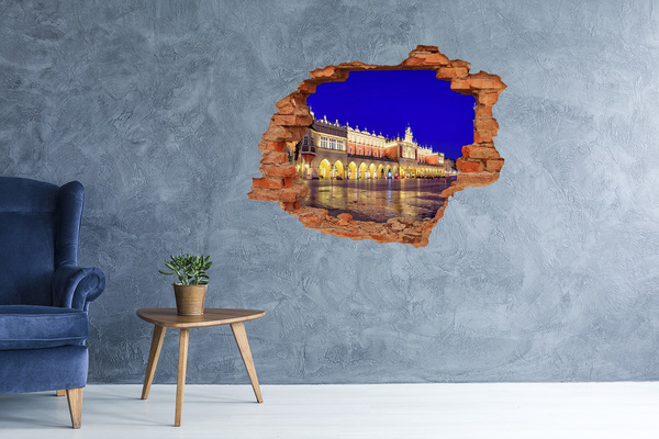 Hole in the wall sticker Krakow's Main Market Square at night