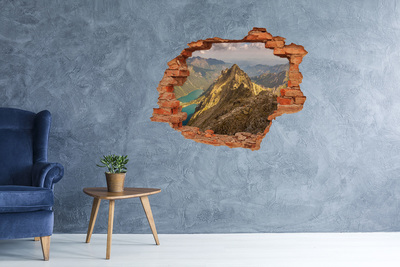 Hole wall sticker Mountain landscape through a hole in the wall