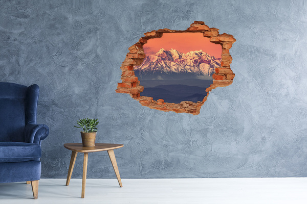 Hole wall sticker Mountains in the glow of sunset