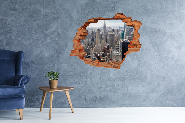 Hole wall sticker View of the city from a hole in the wall