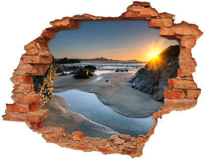 Hole in the wall sticker Sunset over the beach