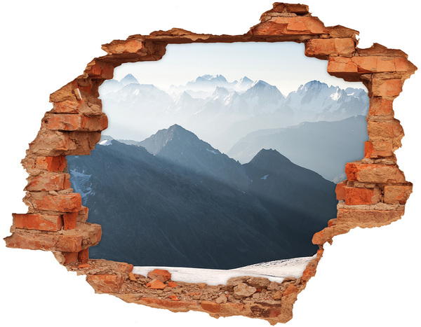 Hole wall sticker Mountain landscape through a hole in the wall