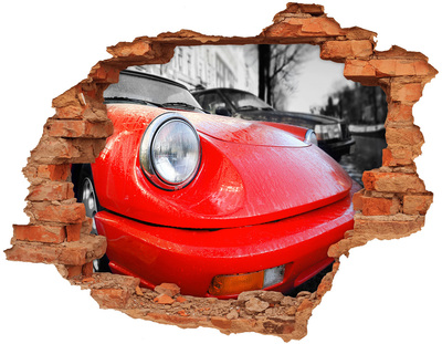 Hole wall sticker Red sports car behind the hole in the wall