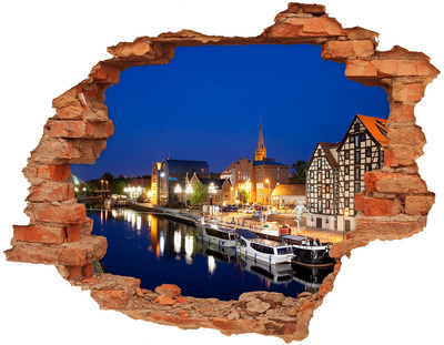 Hole in the wall sticker Night view of the city by the river