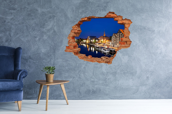 Hole in the wall sticker Night view of the city by the river