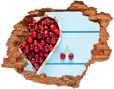 Hole wall sticker Sweet cherries on a blue background