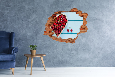 Hole wall sticker Sweet cherries on a blue background