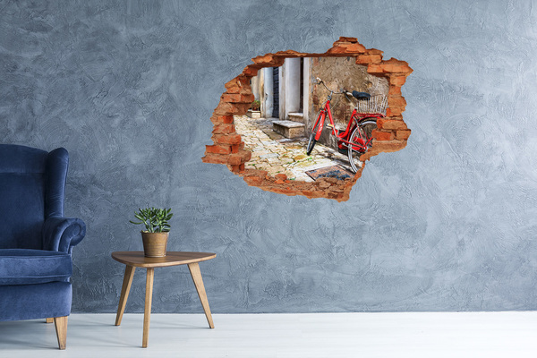 Hole in the wall sticker A red bicycle in a charming street