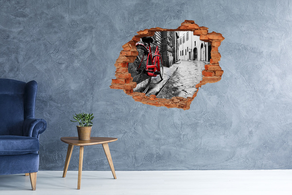 Hole in the wall sticker A red bicycle in a charming street