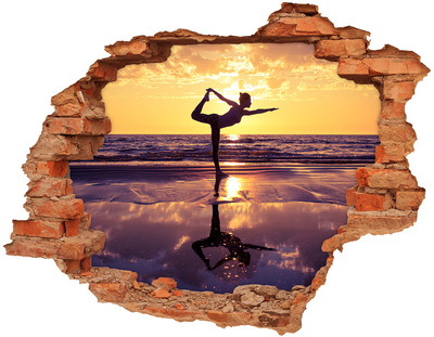Hole in the wall sticker Yoga on the beach at sunset