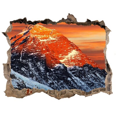 Hole wall sticker Mountains in the setting sun