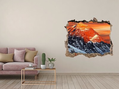 Hole wall sticker Mountains in the setting sun