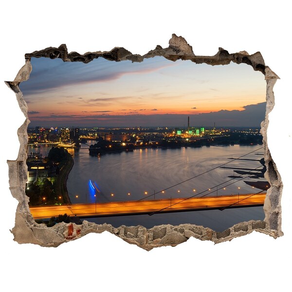 Hole in the wall sticker View of the city at sunset