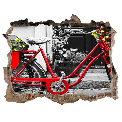 Hole in the wall decal A red bicycle in an urban setting