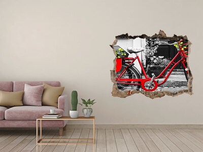 Hole in the wall decal A red bicycle in an urban setting
