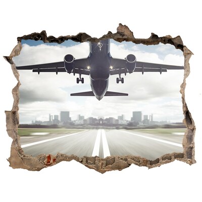 Hole in the wall sticker Plane landing in the city