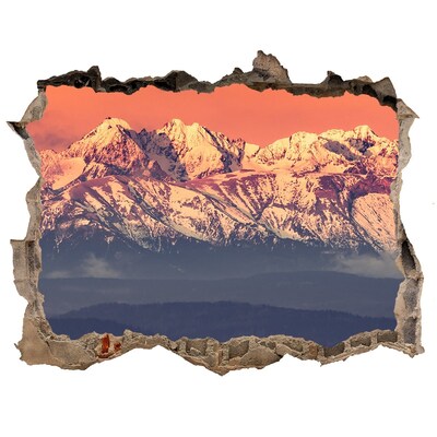Hole wall sticker Mountains in the glow of sunset
