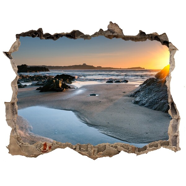 Hole in the wall sticker Sunset over the beach