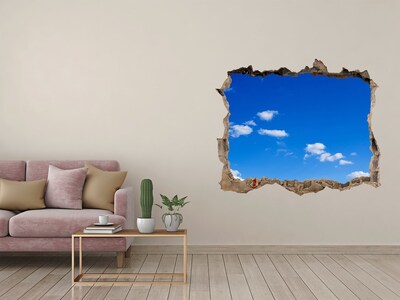 Hole in the wall sticker Blue sky with clouds