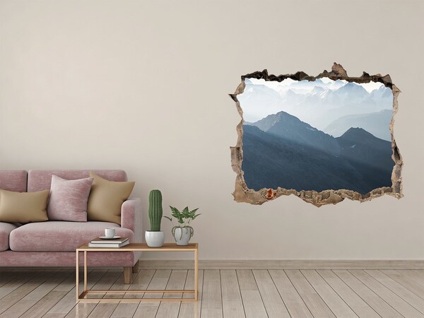 Hole wall sticker Mountain landscape through a hole in the wall