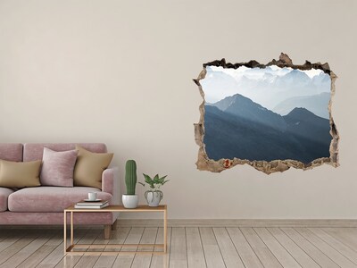 Hole wall sticker Mountain landscape through a hole in the wall