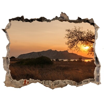 Hole wall sticker Sunset over a mountain landscape