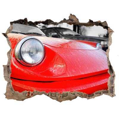 Hole wall sticker Red sports car behind the hole in the wall