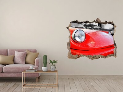 Hole wall sticker Red sports car behind the hole in the wall