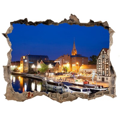 Hole in the wall sticker Night view of the city by the river