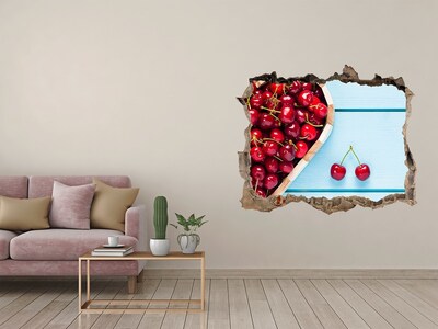 Hole wall sticker Sweet cherries on a blue background