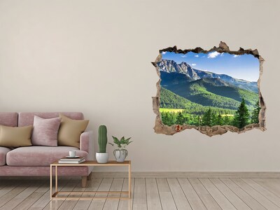 Hole in the wall sticker Mountain landscape through a hole in the wall
