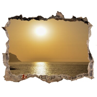 Hole wall sticker Sunset over the sea