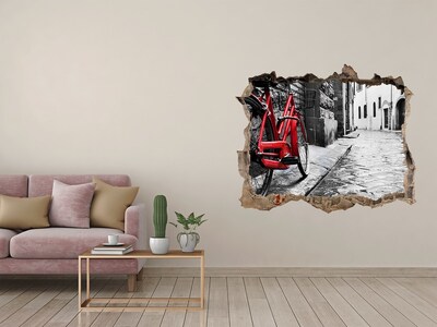 Hole in the wall sticker A red bicycle in a charming street