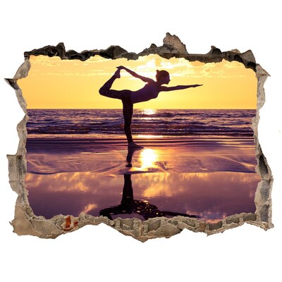 Hole in the wall sticker Yoga on the beach at sunset
