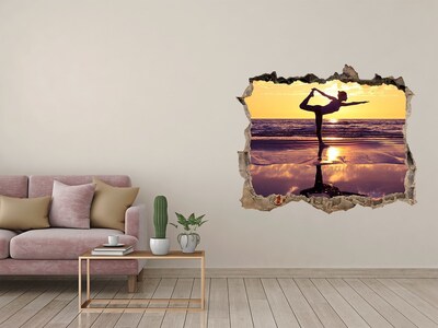 Hole in the wall sticker Yoga on the beach at sunset