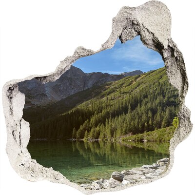 Hole wall sticker Mountain lake in the valley