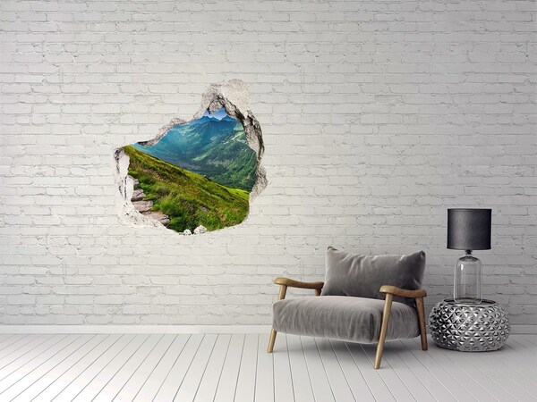 Hole in the wall sticker Mountain landscape behind the hole in the wall